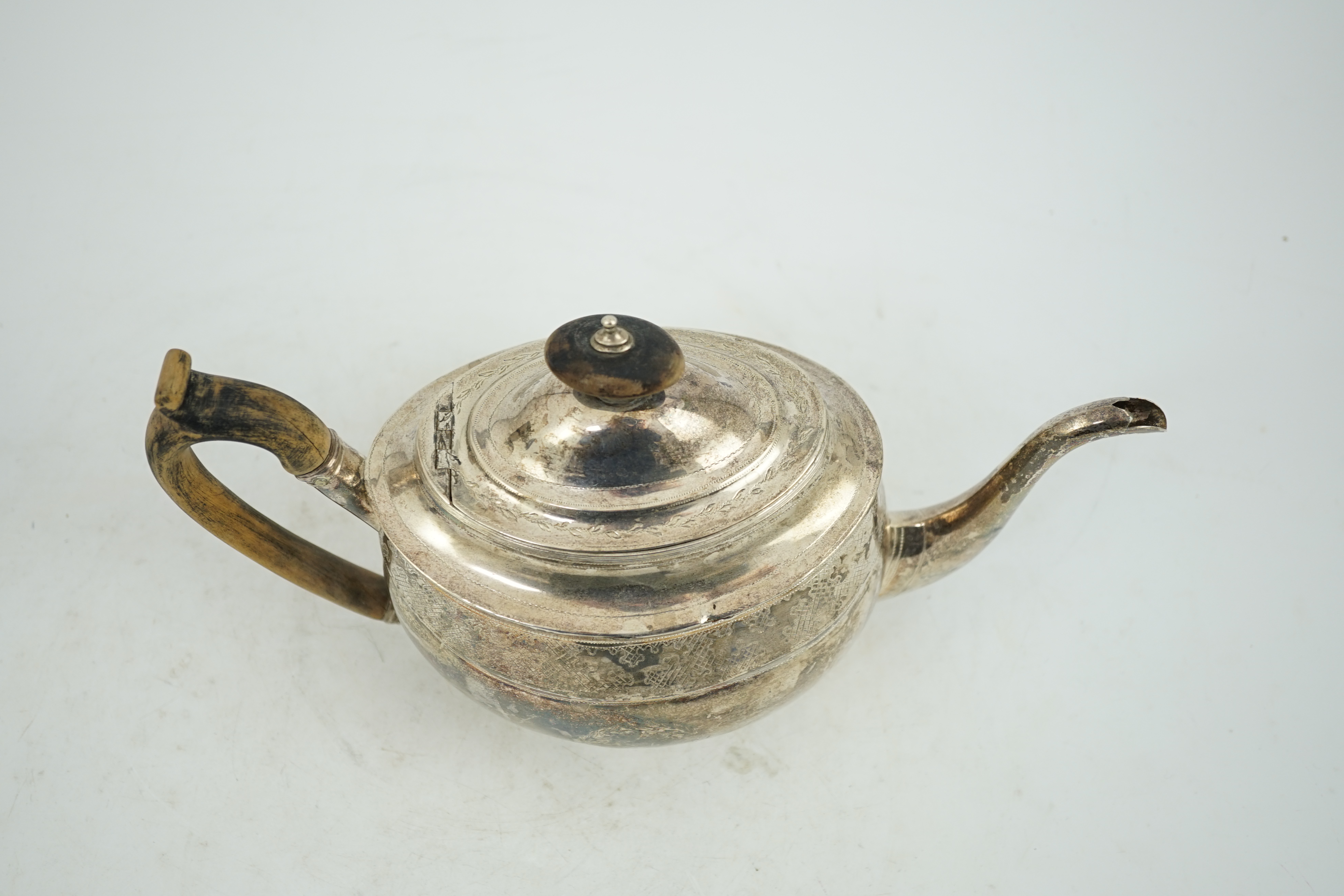 A George III engraved silver oval teapot, Alice & George Burrows, London, 1803, gross weight 13.2oz.